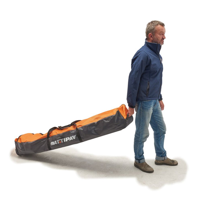 Soft carry case in orange and gray with carry handle and shoulder straps, in use by person