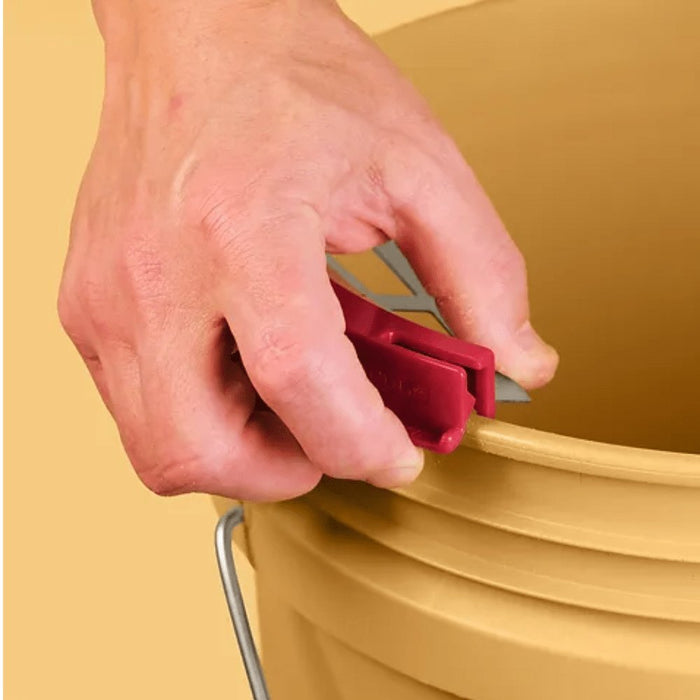 Bucky Scraper in use: hand holding red scraper over a yellow bucket rim