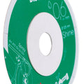 Close-up of a green and white disc with text and graphics.