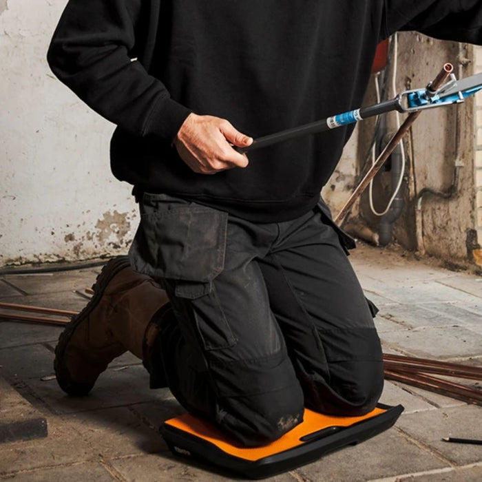 Orange-and-black Kneeler board M2 with textured top pad and black base