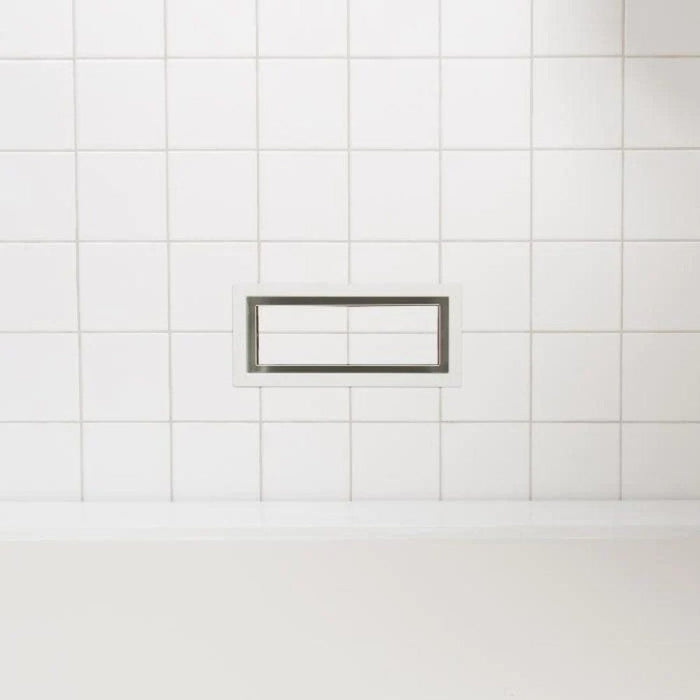 Small rectangular framed floor vent with metal edge and inset opening