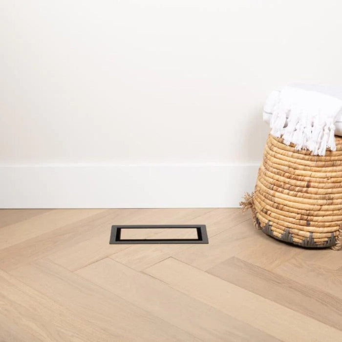 Framed OG floor vent with dark border and narrow rectangular slot