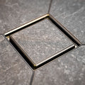 FloFX Tile-In Drain Grate in Satin Gold finish for compatible FloFX shower drain