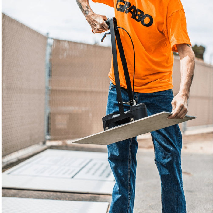 Lifting attachment in use lifting a large panel with suction base and handle