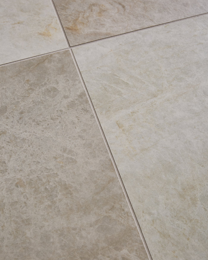 Hoxton Porcelain Linen Matt floor tiles laid on the diagonal, close up on the joint where four tiles meet, showing the soft grey-beige surface and fine ochre veining