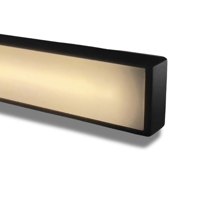 Illuminated LED niche with warm glow, black frame, slim recessed light opening