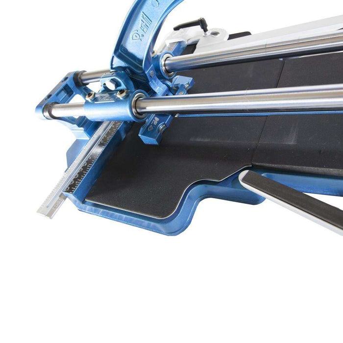 Porcelain tile cutter close-up: blue frame, steel rails, black cutting surface