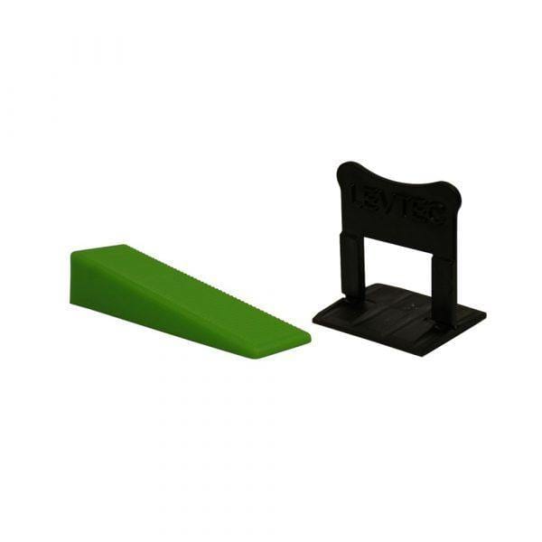 Green leveling clip and black base spacer from the leveling system kit