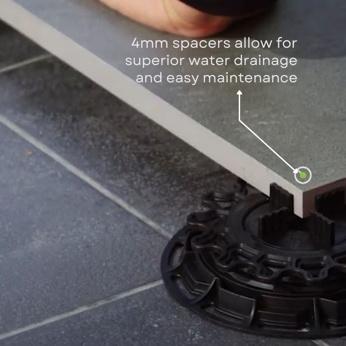 Pedestal unit under paving tile with 4mm spacer rings for drainage, black