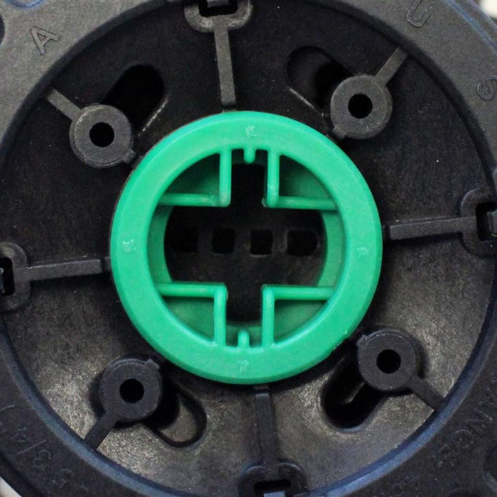 Pedestal base insert close-up with green locking cross for threaded adjustment