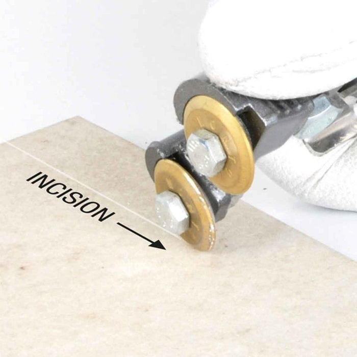 Crab tile nippers trimming a porcelain tile edge; adjustable cutting wheels