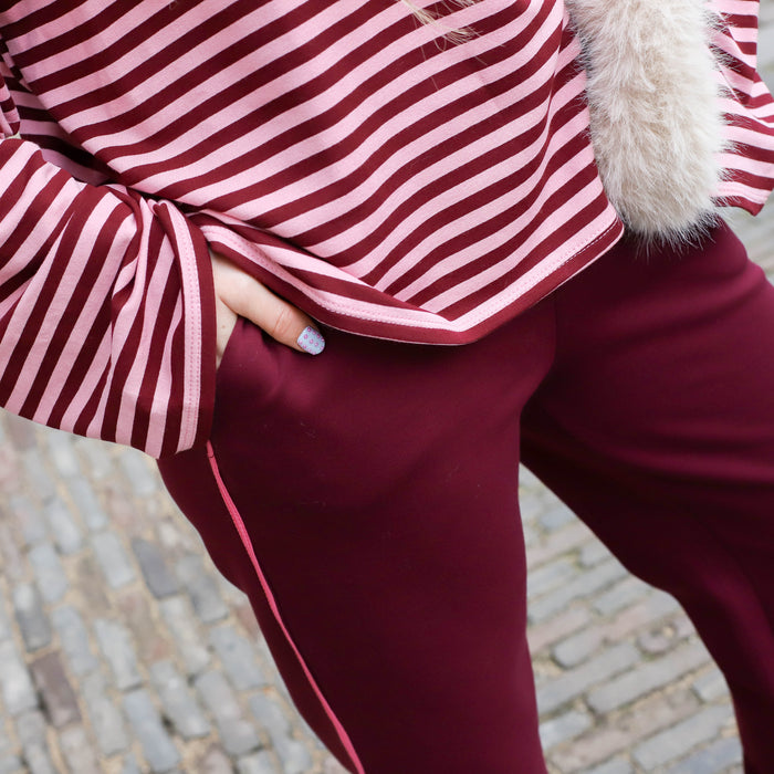 Pantalon burgundy roze bies