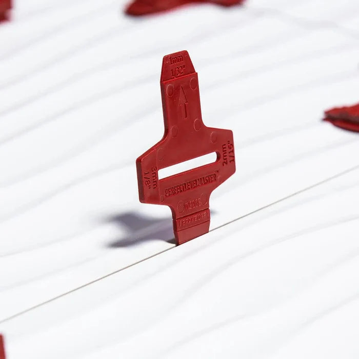 Red T-lock tile base with 1/16 in marking and central grip handle