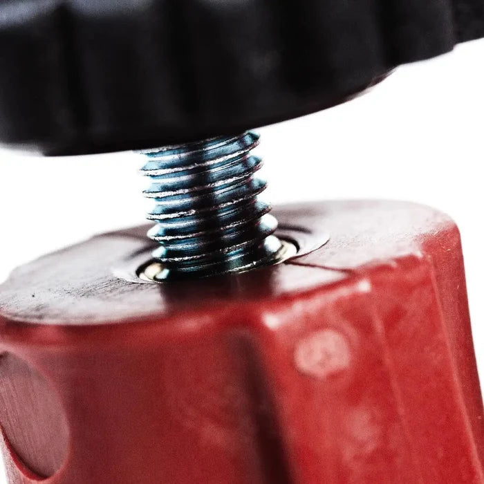 Red T-Lock pliers close-up showing threaded screw and metal spring base