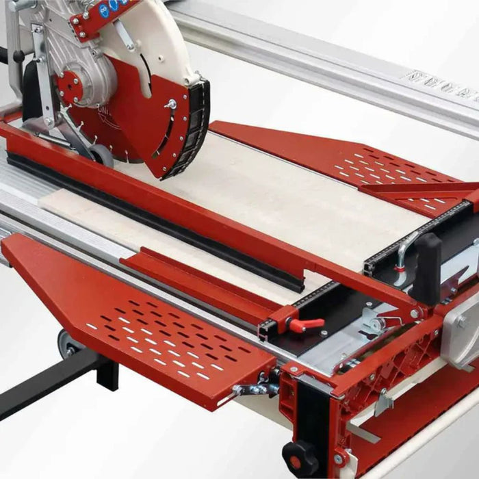 Raimondi tile hold-down bar mounted on tile saw, with red perforated support plates