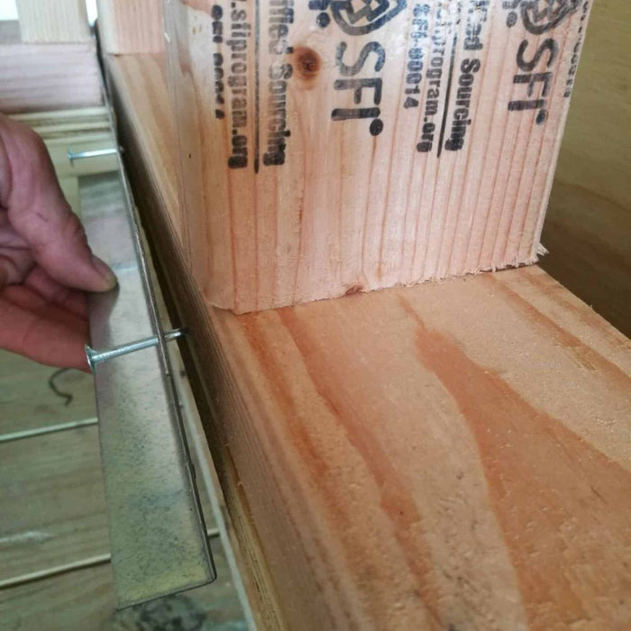 L-shaped single bracket on wooden support, galvanized sheet metal with holes