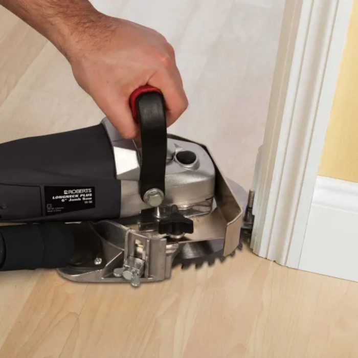 Jamb saw cutting along a floor edge beside a vertical trim piece