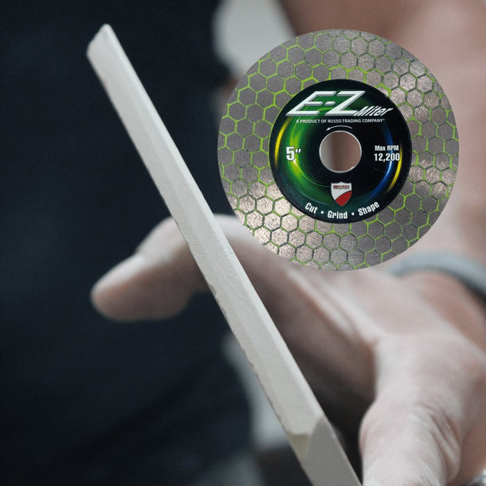 E-Z Miter 5 in miter disc held near a blade for cutting, grinding, shaping