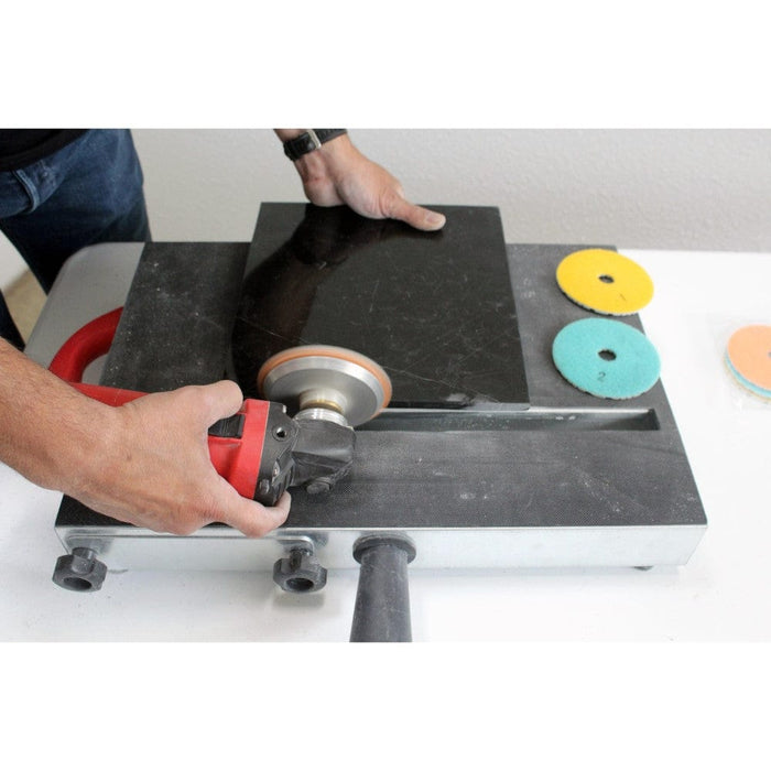 Dry polishing setup: Angle grinder on polishing pad with red/brown disc
