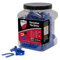 Horseshoe tile shims in blue, plastic spacers for maintaining tile gaps