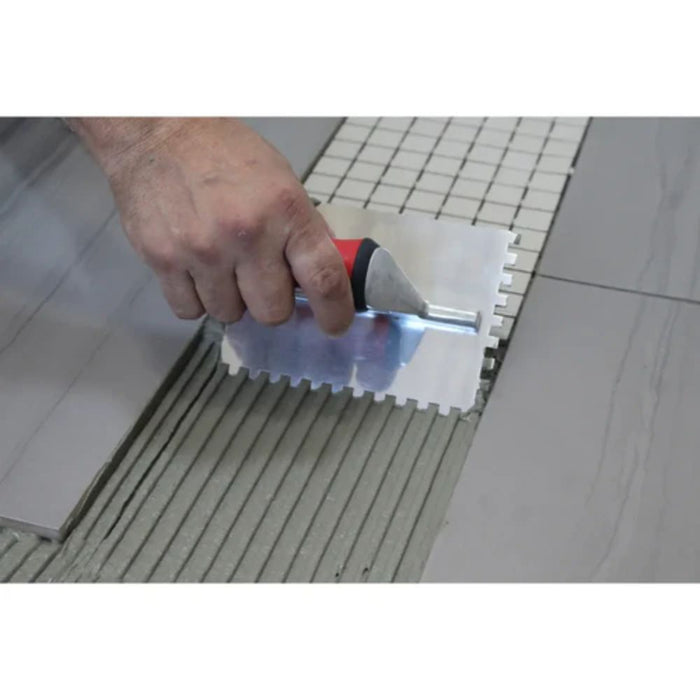 RTC mini trowel spreading thinset with serrated notched edge for tile