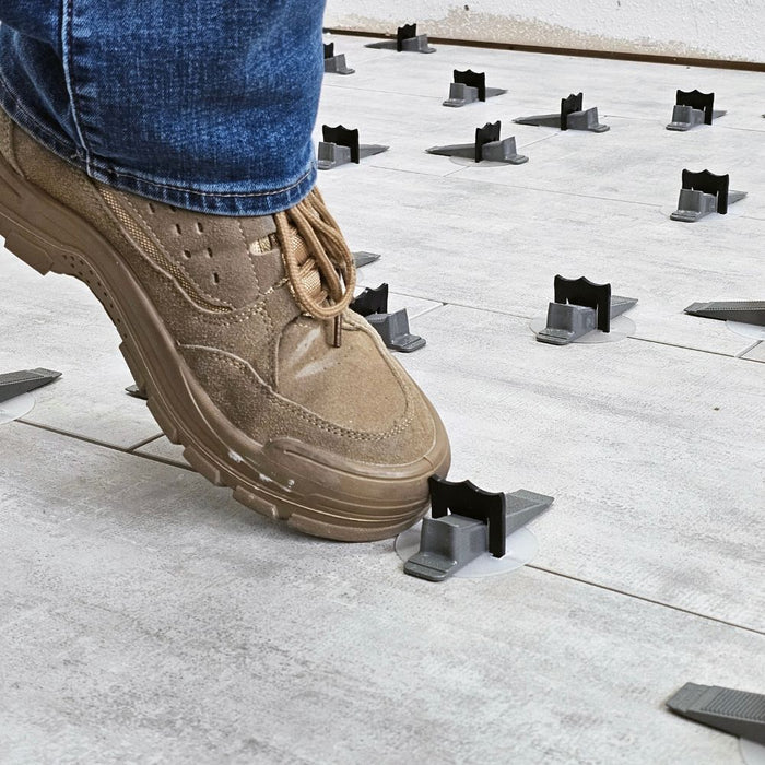 Wedge MD Tile Leveling System wedge can be removed with a mallet or a kick