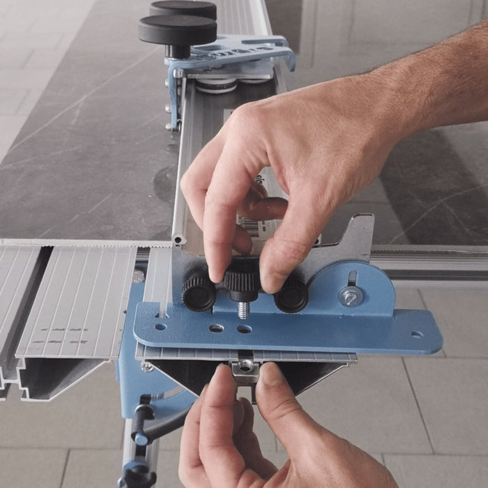 Hands installing rotating table support mounting kit on table track