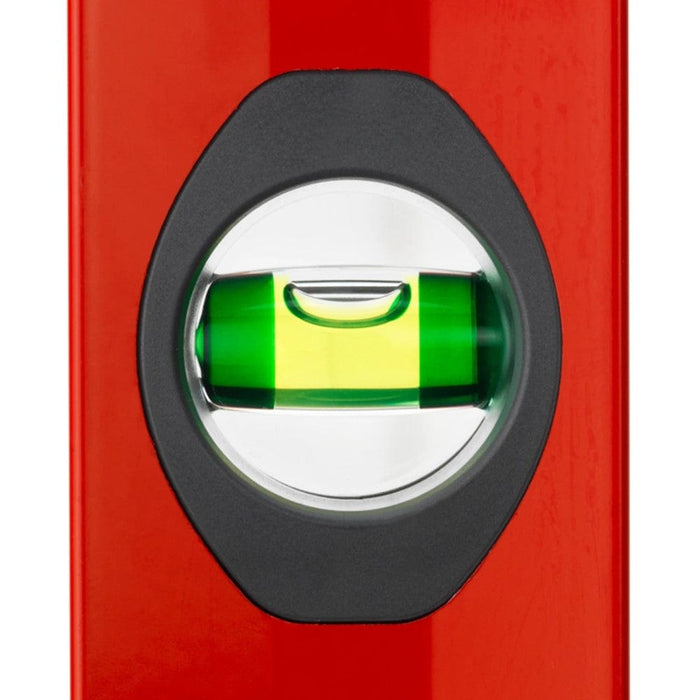 Close-up of green spirit vial in black round viewing window on red level